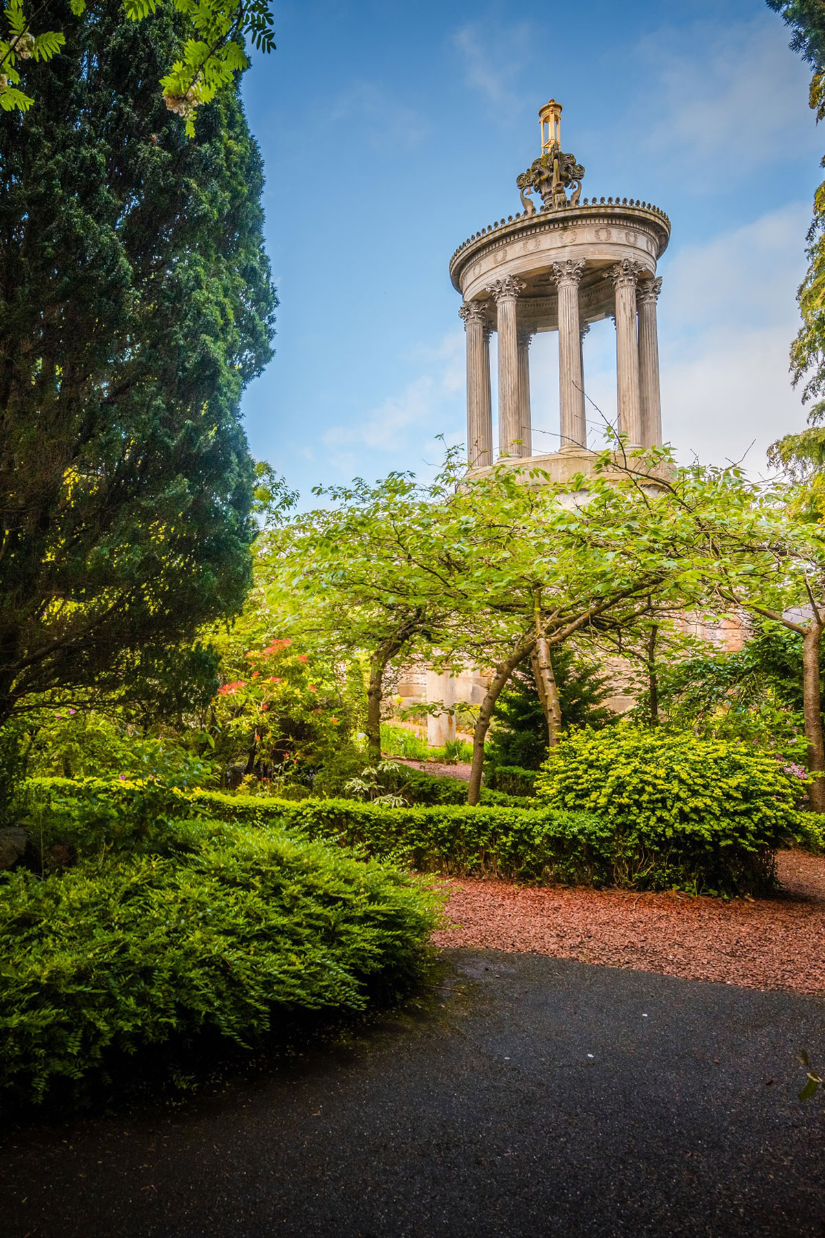 outdoor shot of Robert Burns Birthplace's garden with the sun shining on them