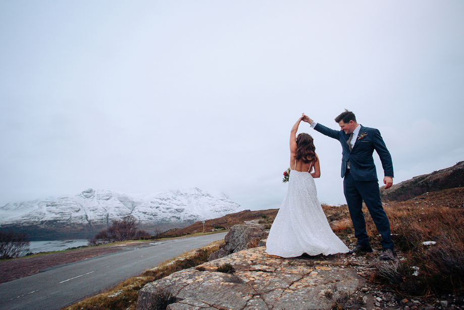 Groom spins bride round in scenic Highland spot