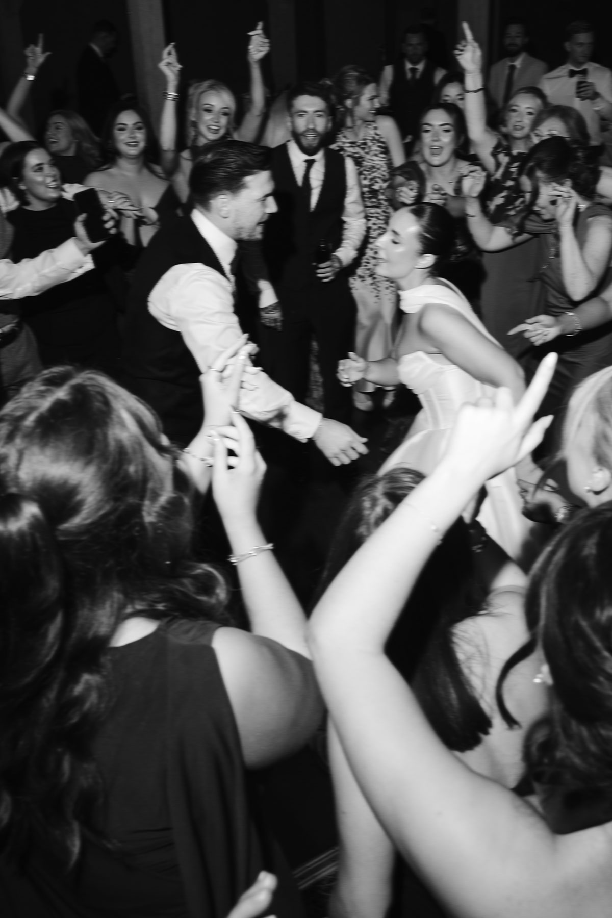 Wedding dancefloor moment with bride and groom surrounded by guests at Enterkine Country House reception