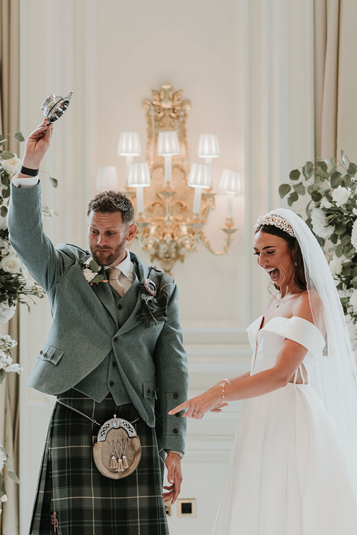 Bride and groom celebrating during wedding ceremony led by celebrant from The Scottish Celebrants