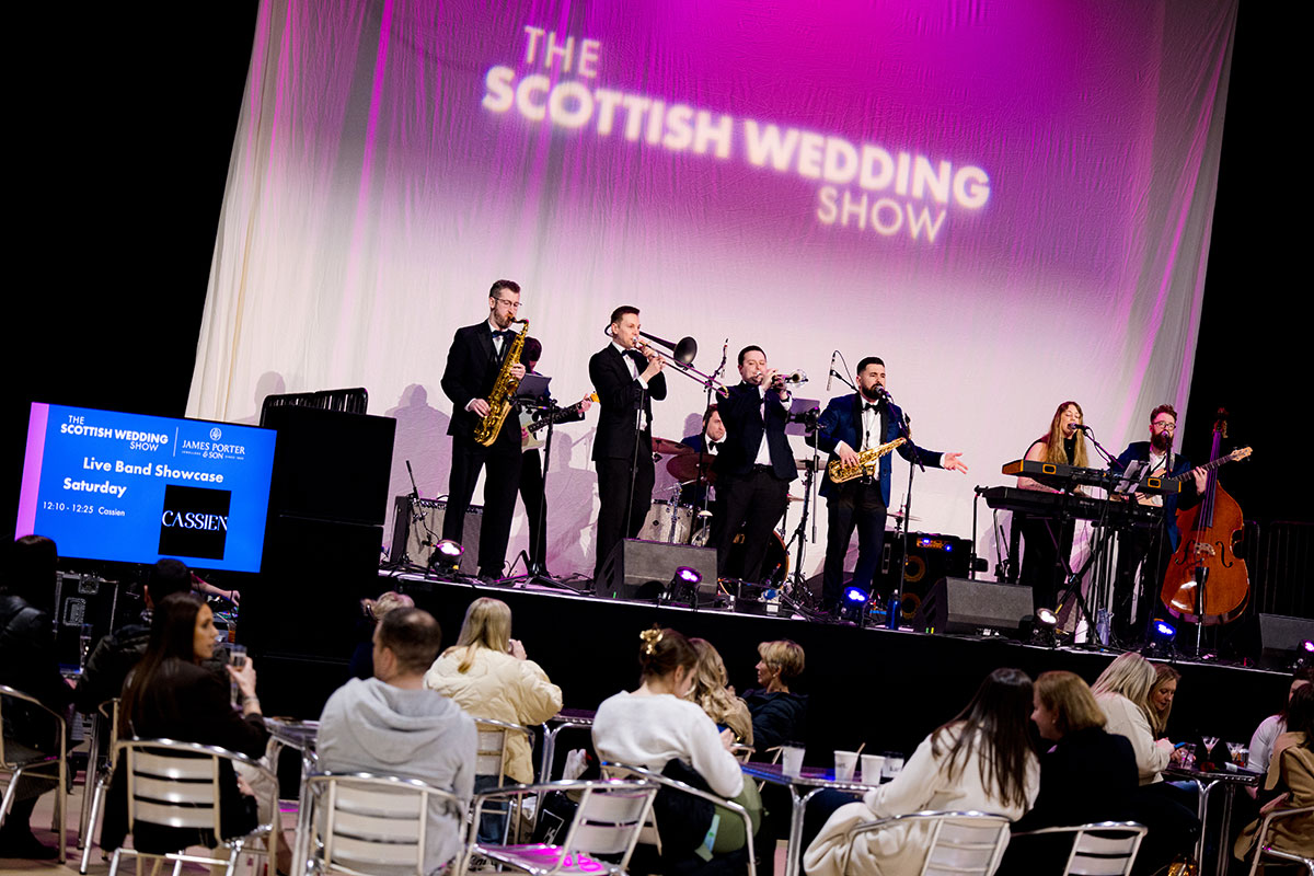 Live wedding band performing on stage during the Live Band Showcase at The Scottish Wedding Show.