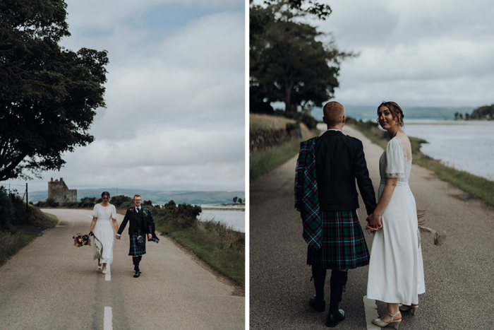 Couple hold hands as they walk down a road on the Isle of Arran