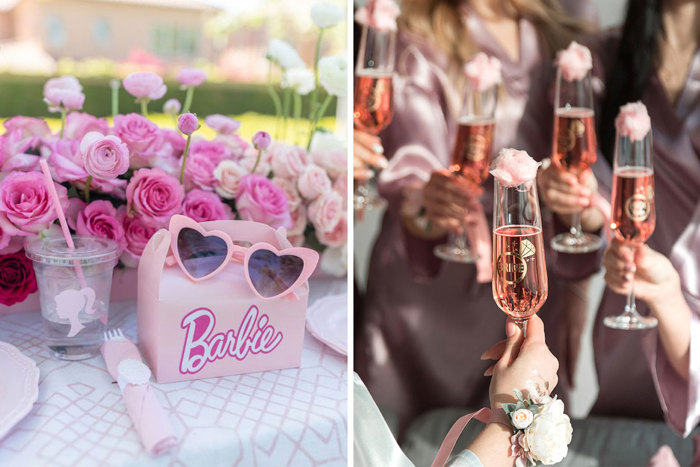 Barbie box beside sunglasses and pink roses and hands holding bridal glasses with pink liquid