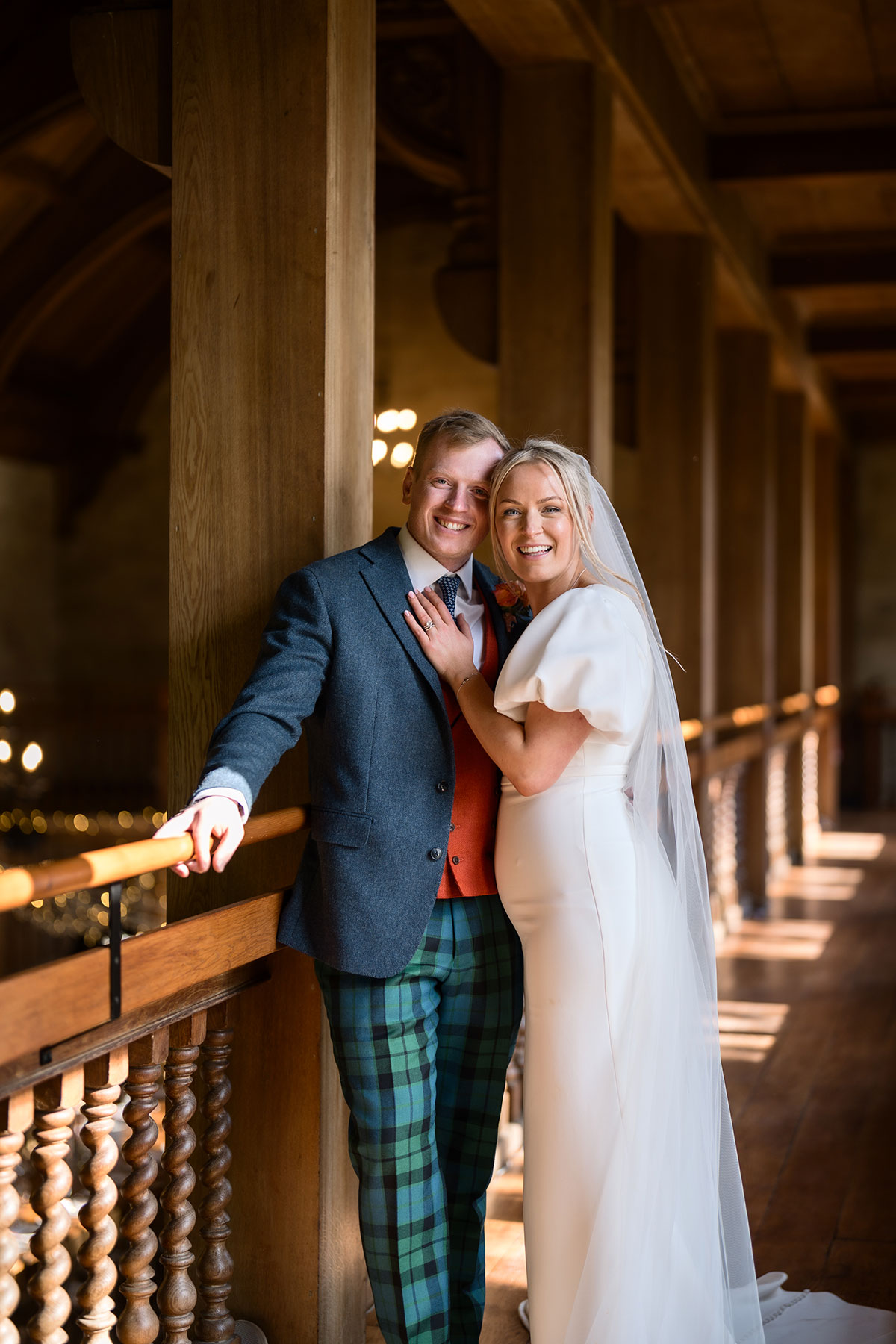 bride and groom lean into one another for photograph at achnagairn castle