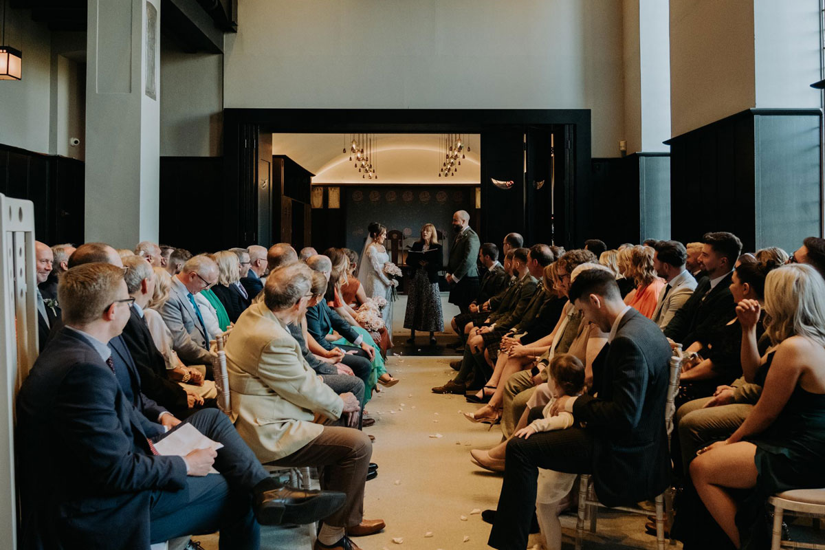 Guests watching wedding ceremony