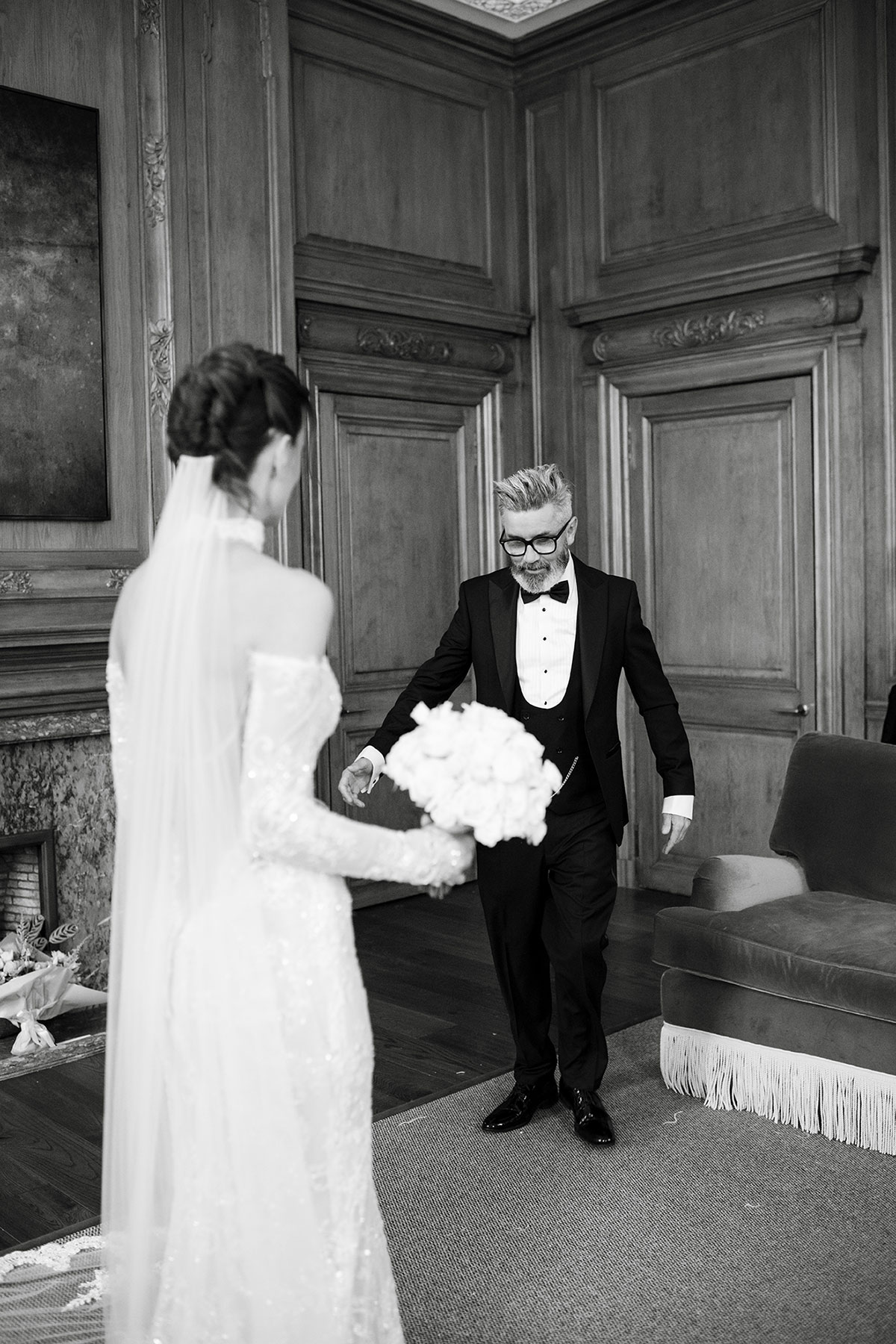 Black and white photo of dad seeing bride in wedding dress at The Signet Library