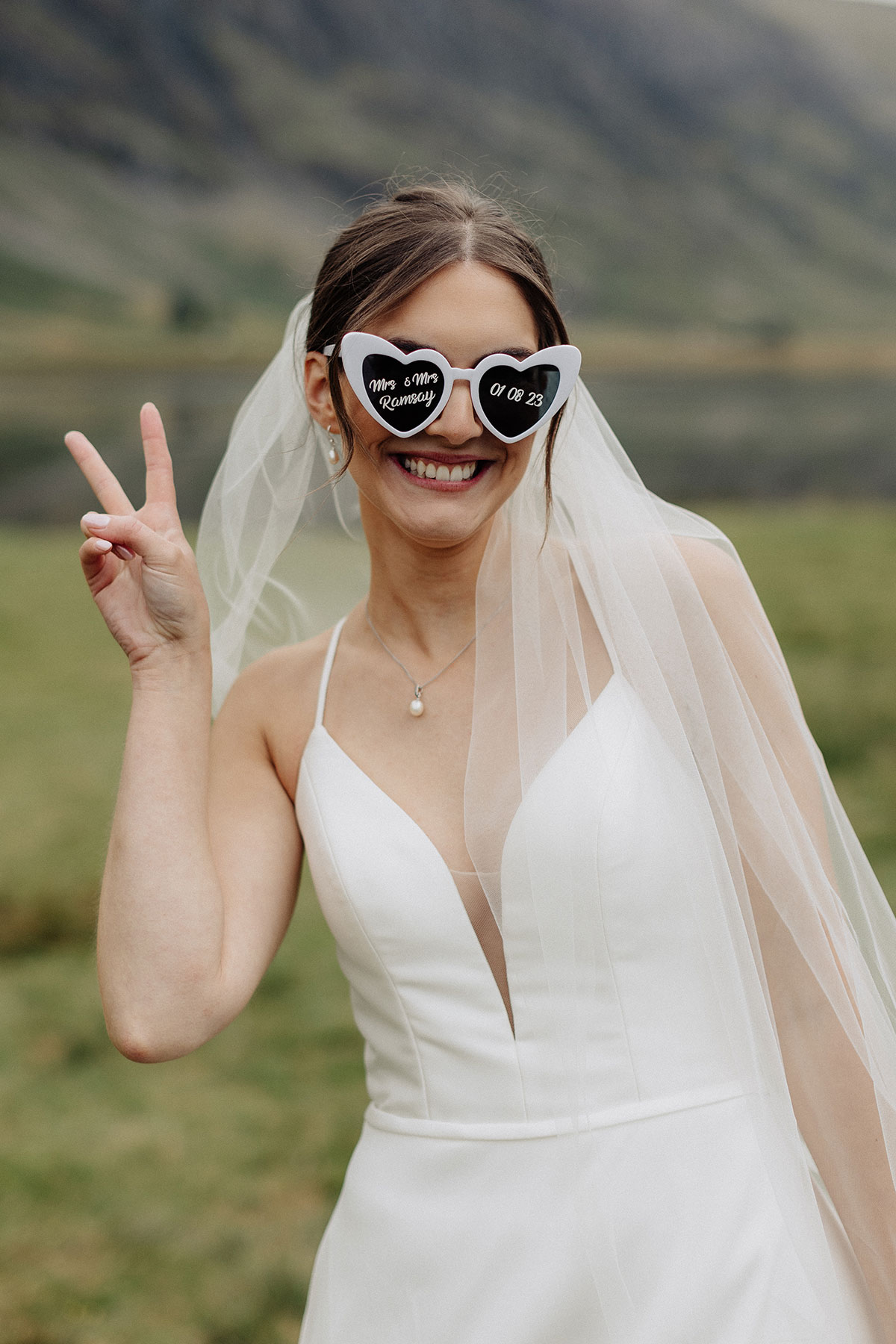 Bride wearing heart shaped sunglasses