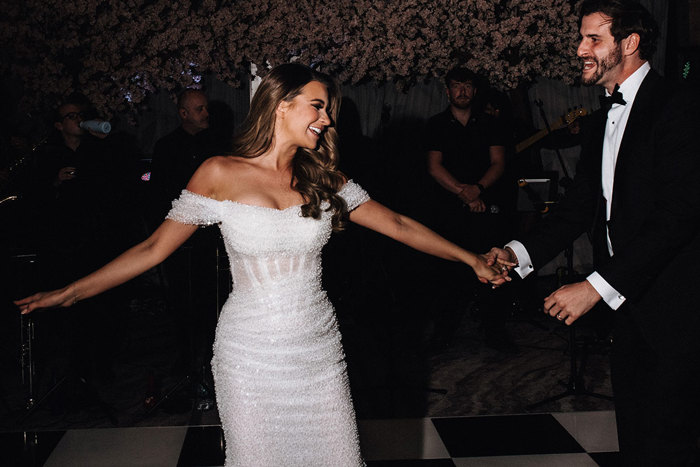 a bride and groom dancing. 