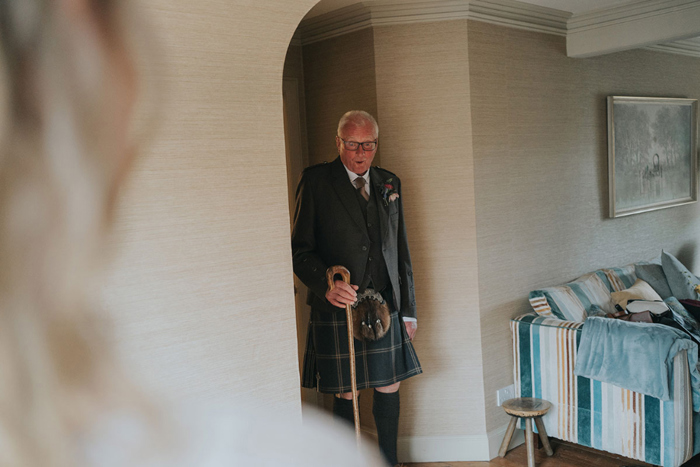 Father of the bride gasps as he sees his daughter in her dress