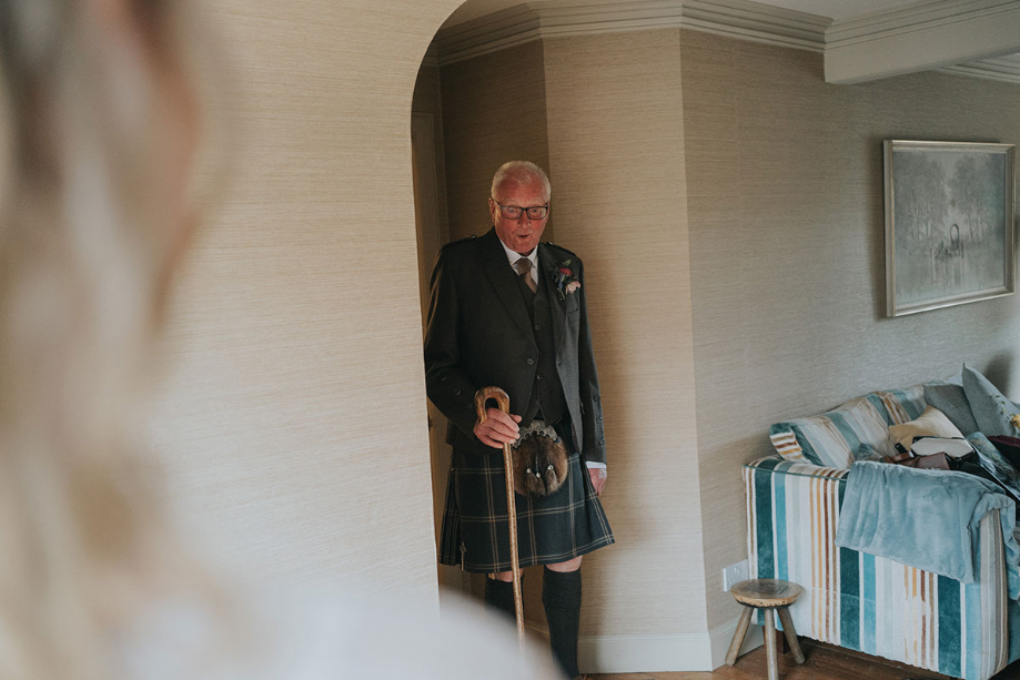 Father of the bride gasps as he sees his daughter in her dress