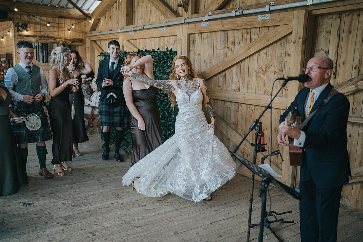 bride and bridesmaid dancing at a wedding