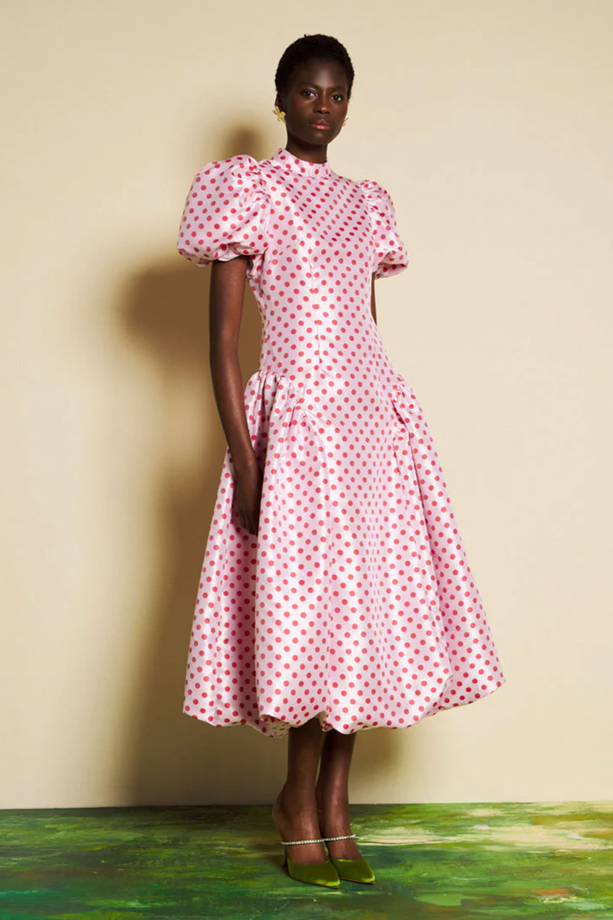 Pink polka dot midi dress with puff sleeves, fitted bodice and full skirt