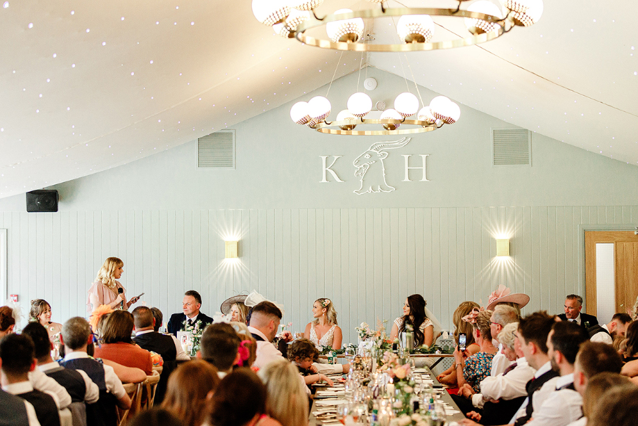 Top table look at bridesmaid giving a speech
