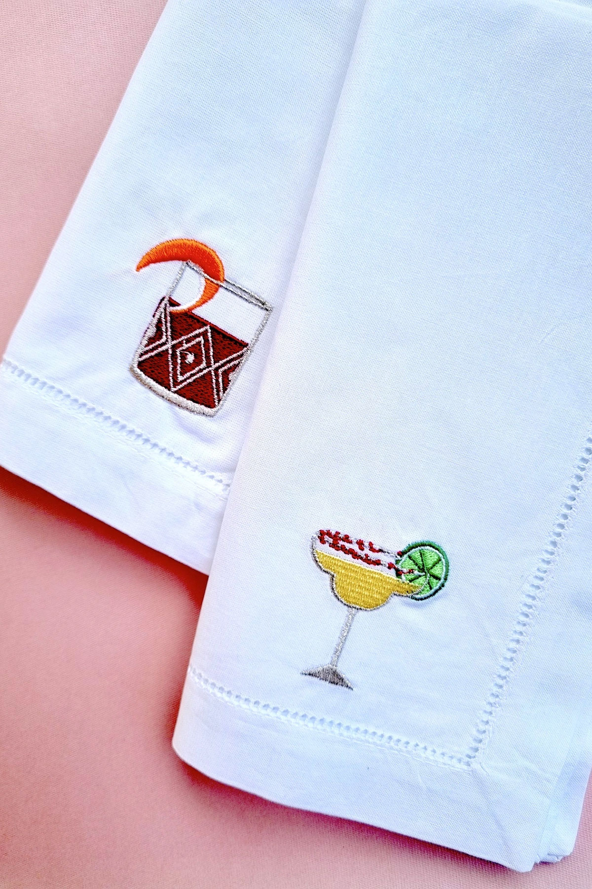 Embroidered cocktail-themed linen napkins featuring a negroni and margarita design, a stylish wedding gift for couples who love entertaining
