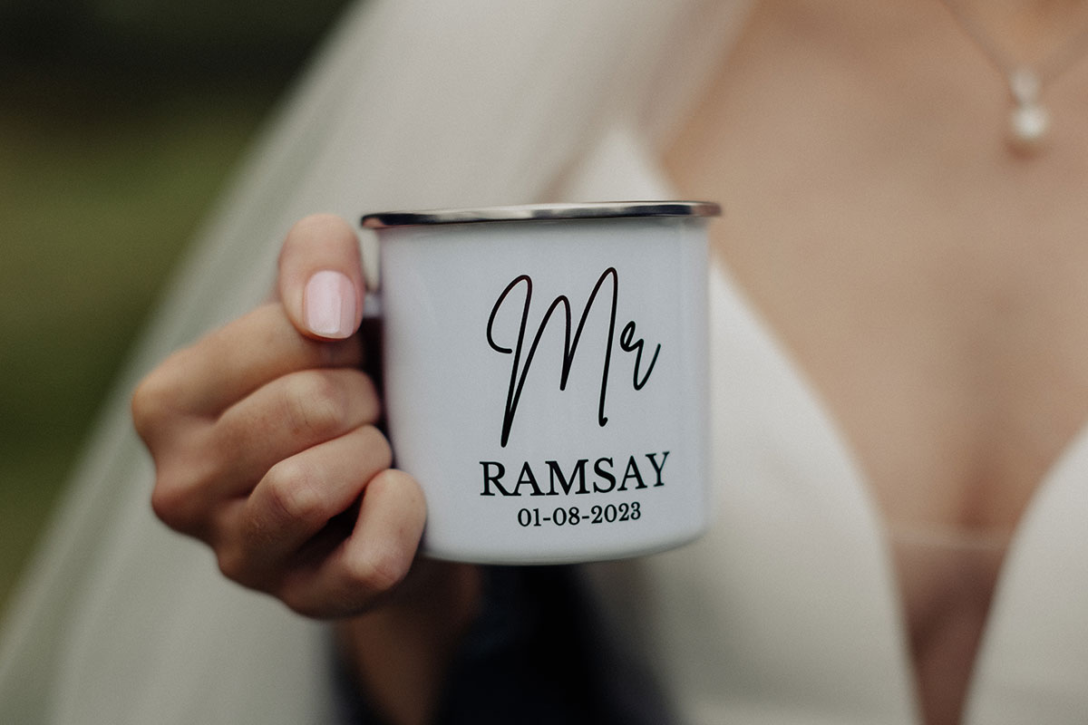 Bride holding a mug reading 'mr ramsay'