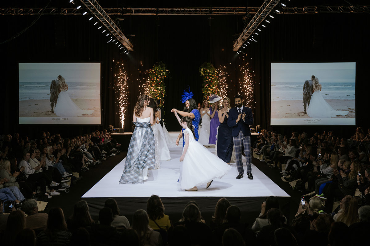brides, flower girls and mother of the brides walk at the RAD Runway at the Scottish Wedding Show 2025