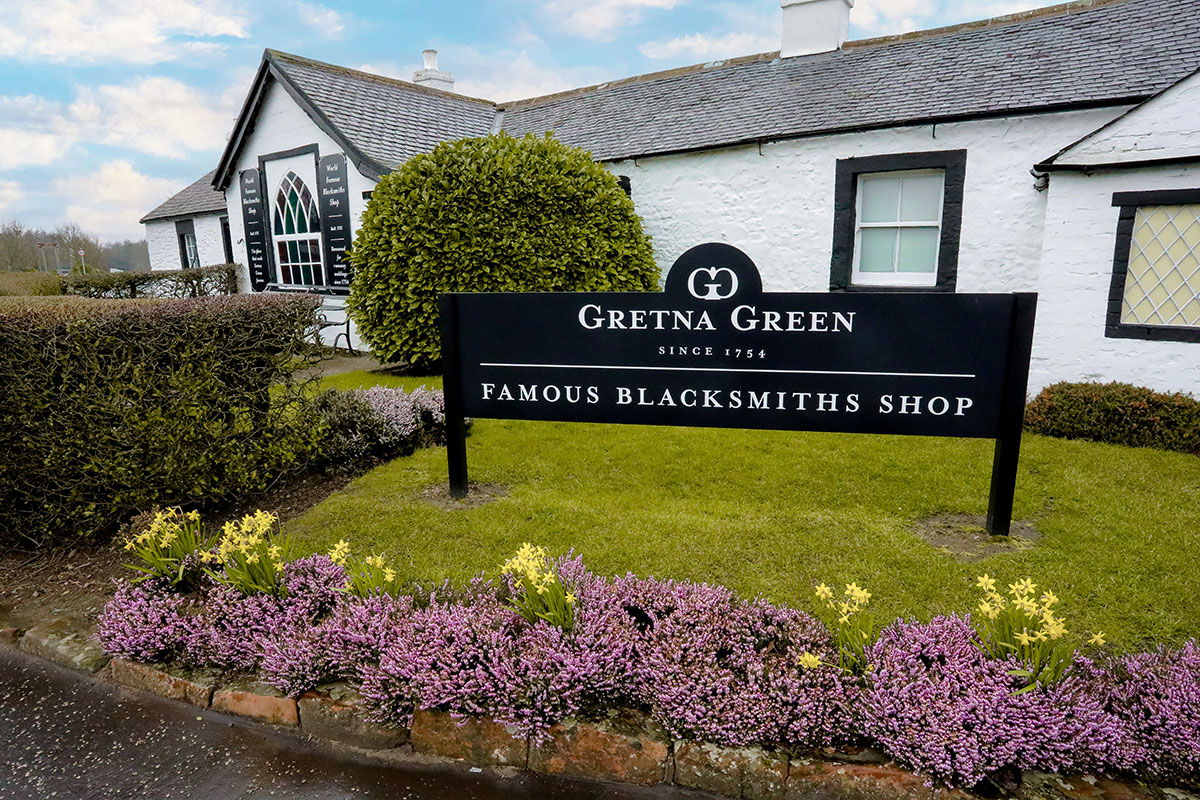 Entrance sign to the Famous Blacksmiths Shop at Gretna Green, Scotland's iconic wedding and elopement destination.