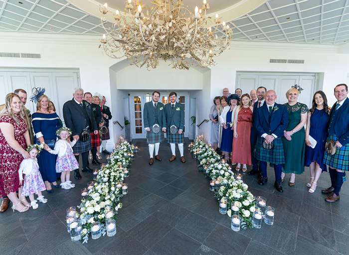 a wedding group portrait in the Conservatory at the Old Course Hotel 