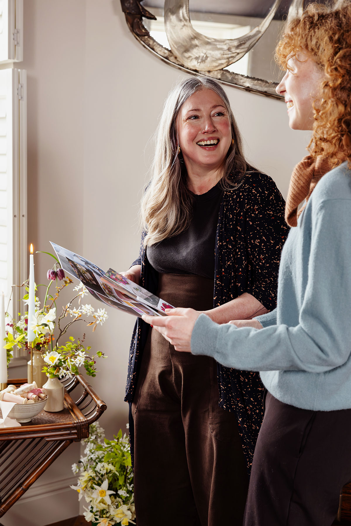 Bride and supplier reviewing wedding ideas and styling details at The Tower Portobello