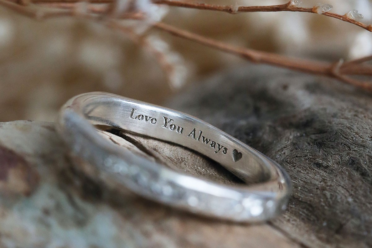 Silver wedding ring by Sheila Fleet engraved inside with the words Love You Always and a heart