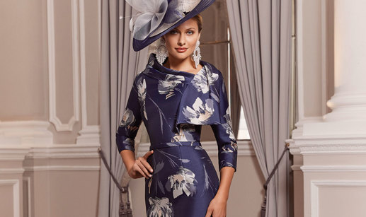 Model wears navy and ivory occasion dress 