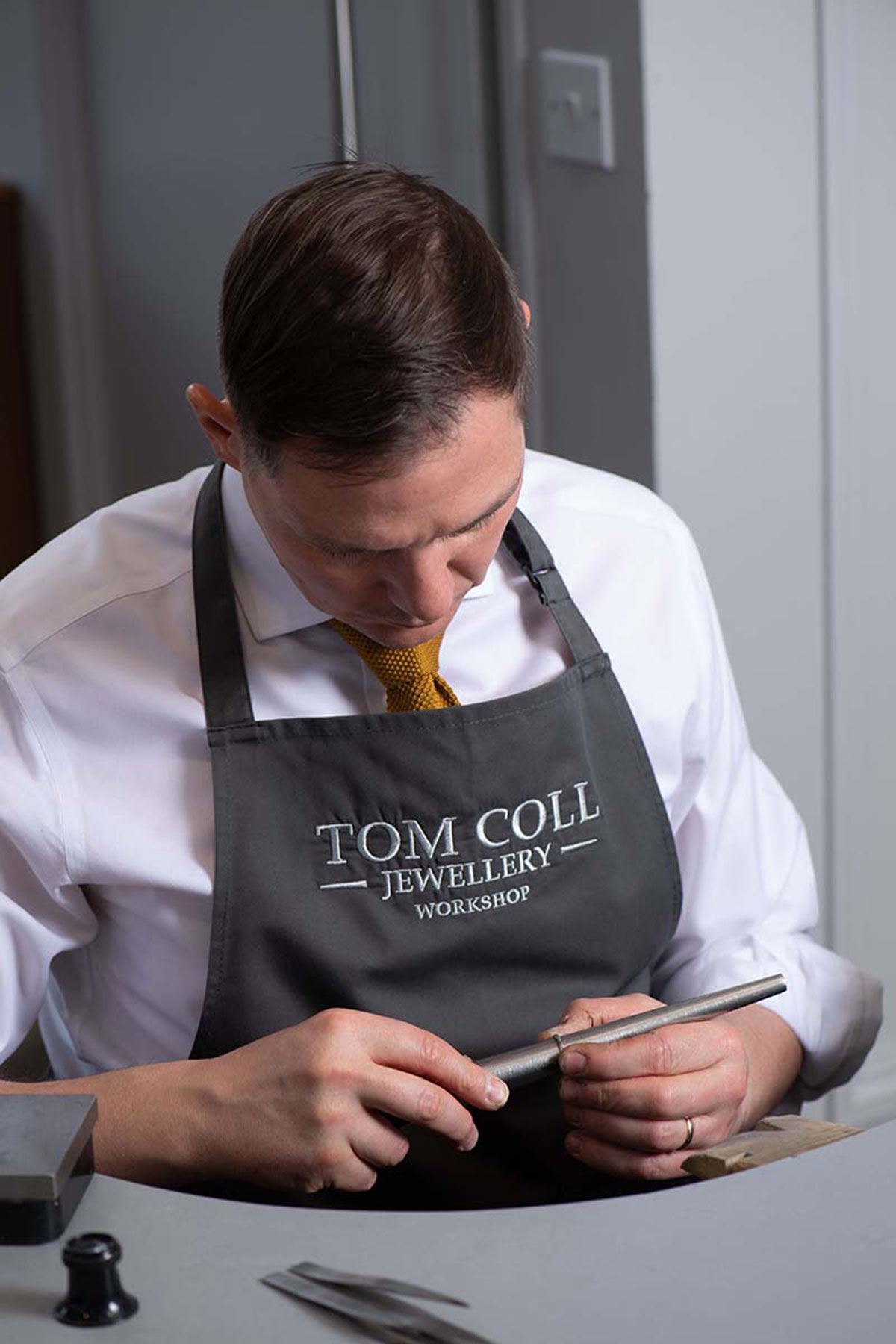 Tom Coll Jewellery craftsman working in the in-house jewellery workshop in Glasgow