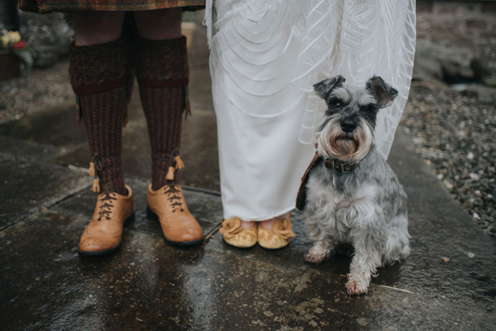 Couple's dog Haggis sits at the feet of the couple