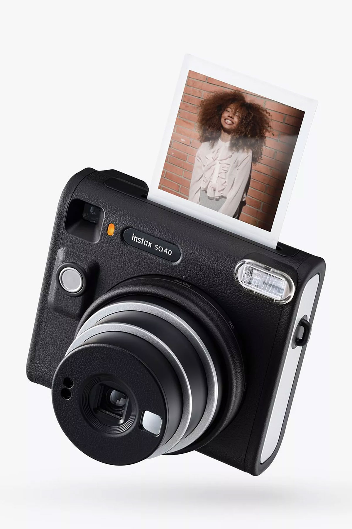 Fujifilm Instax Square SQ40 instant camera printing a photo, a fun wedding gift idea for couples who love capturing memories