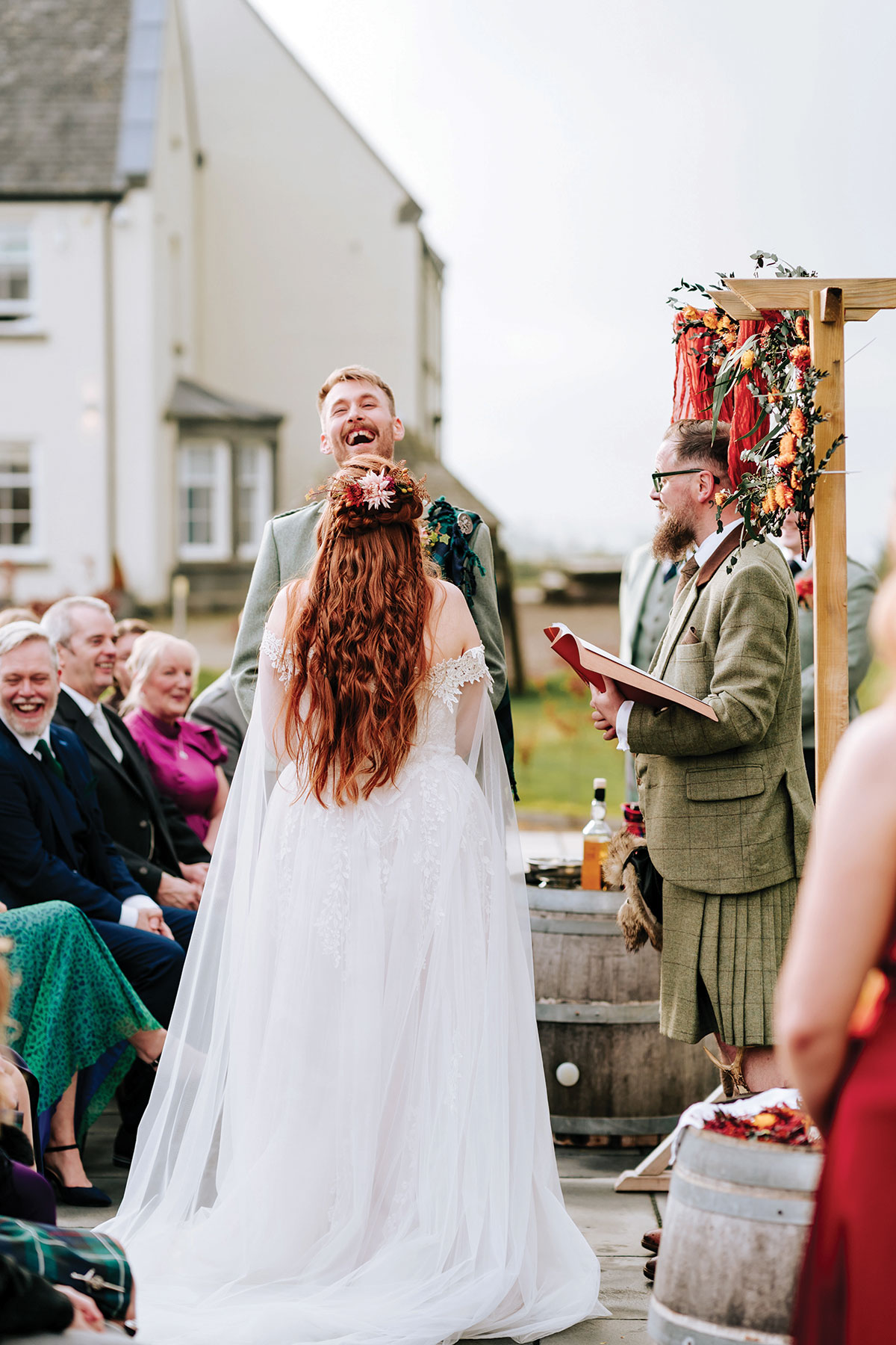 Outdoor humanist wedding ceremony in Scotland with celebrant and guests seated outside
