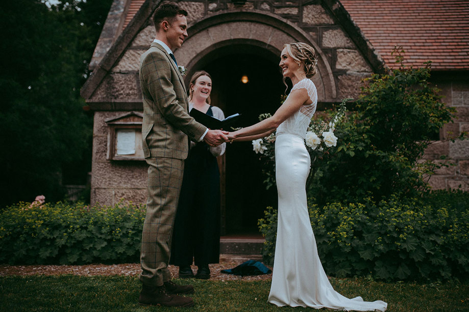 wedding ceremony with bride, groom and celebrant mar lodge