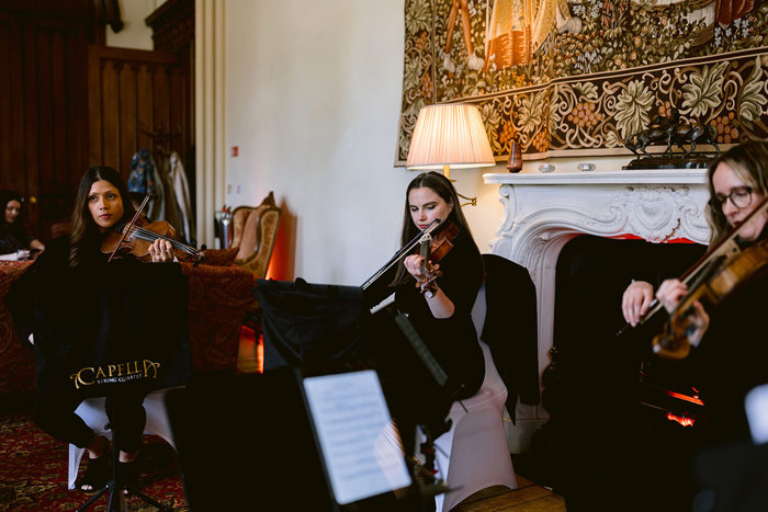 A group of people playing instruments at Mar Hall.