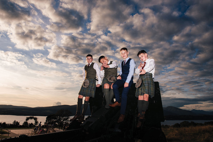 Young male guests in kilts