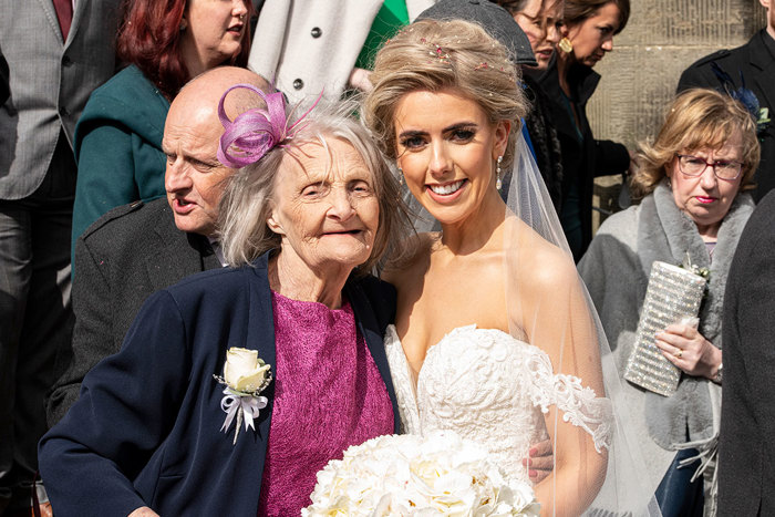 A Smiling Bride With An Elderly Wedding Guest