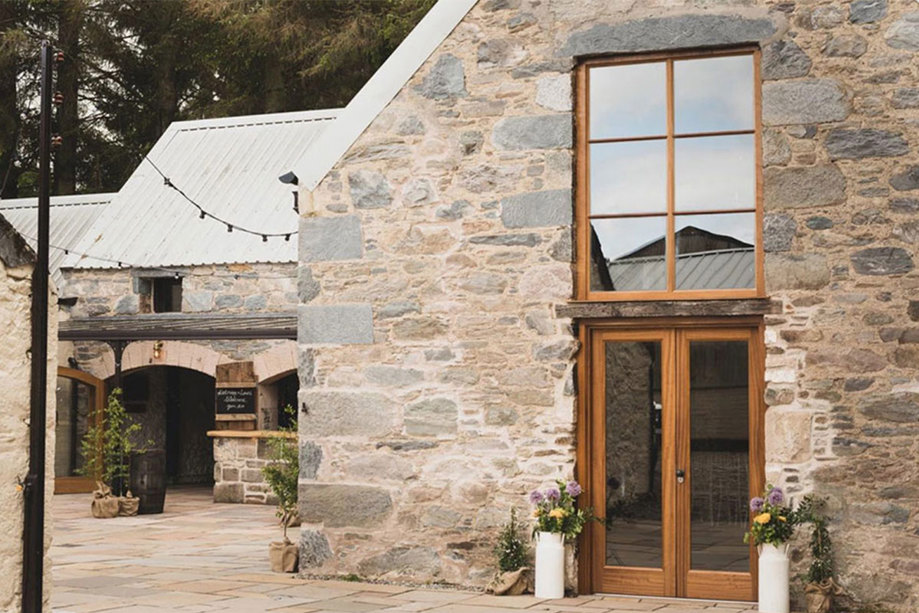 The exterior of a stone barn