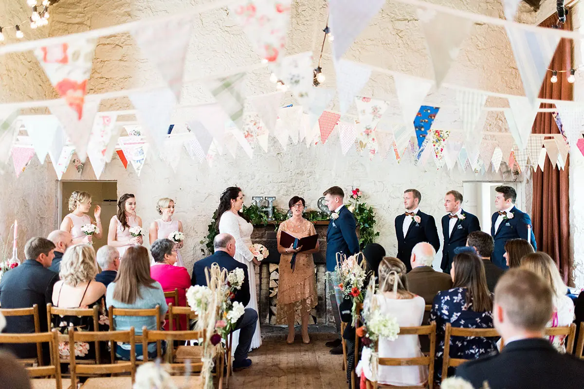 Bride and groom standing at altar during their ceremony