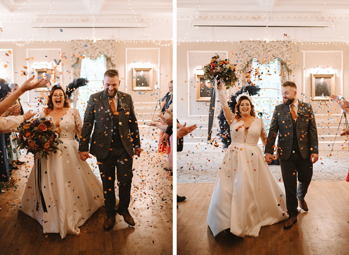 a bride and groom walk down the aisle while being showered in colourful confetti