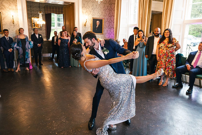 a bride and groom performing a dance during a wedding reception at Blairquhan Castle
