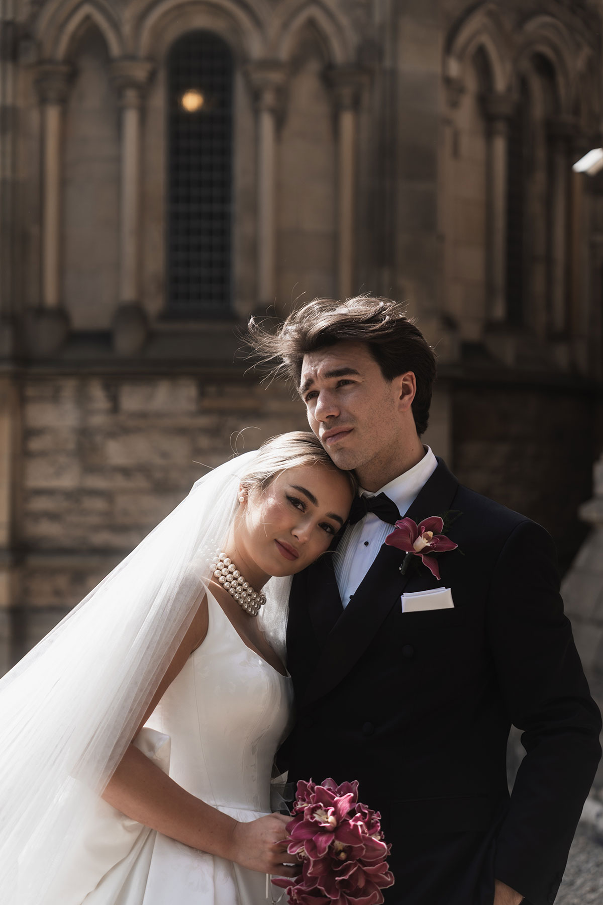 Bride and groom elegant portrait outside Mansfield Traquair with bouquet and black tie styling