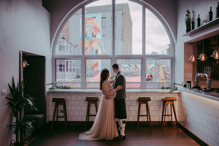 Bride And Groom By Arched Window At Barras Art And Design Baad