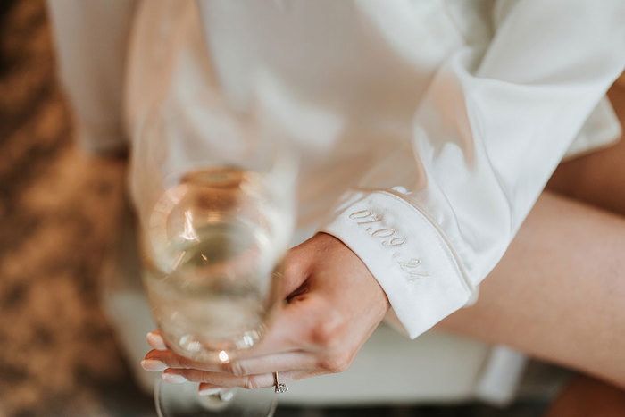 an embroidered cuff on white pyjamas