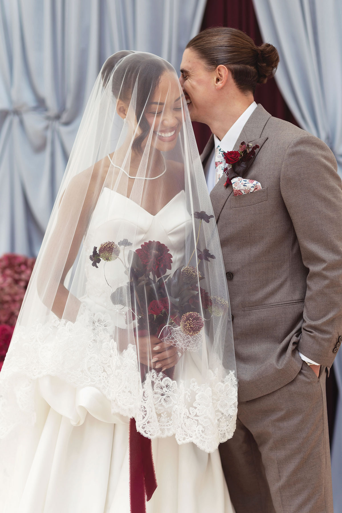 Bride and groom smiling together at Carlowrie Castle wedding