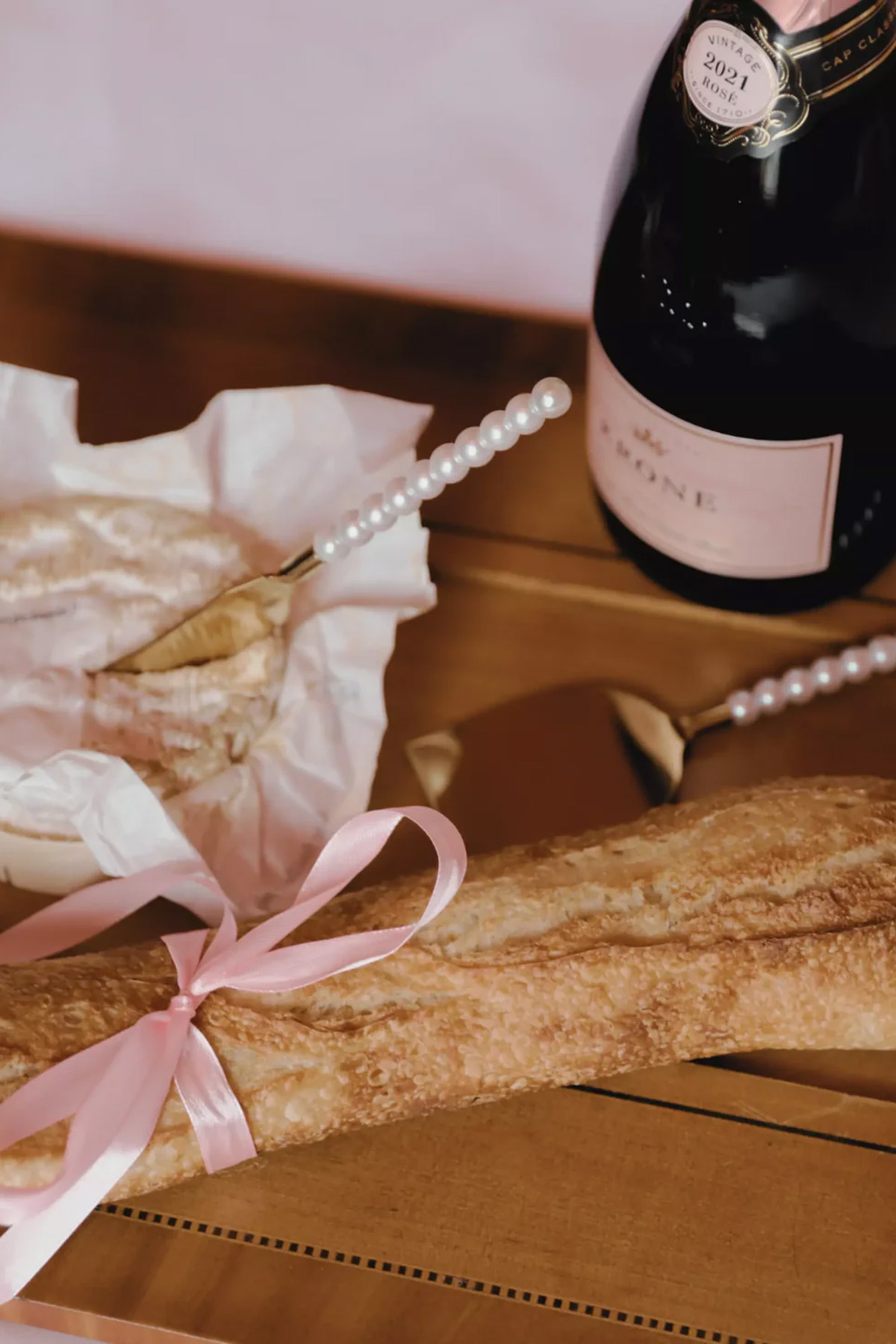 Gold cheese knives with pearl-style handles, a thoughtful wedding gift for couples who love hosting and cheeseboards