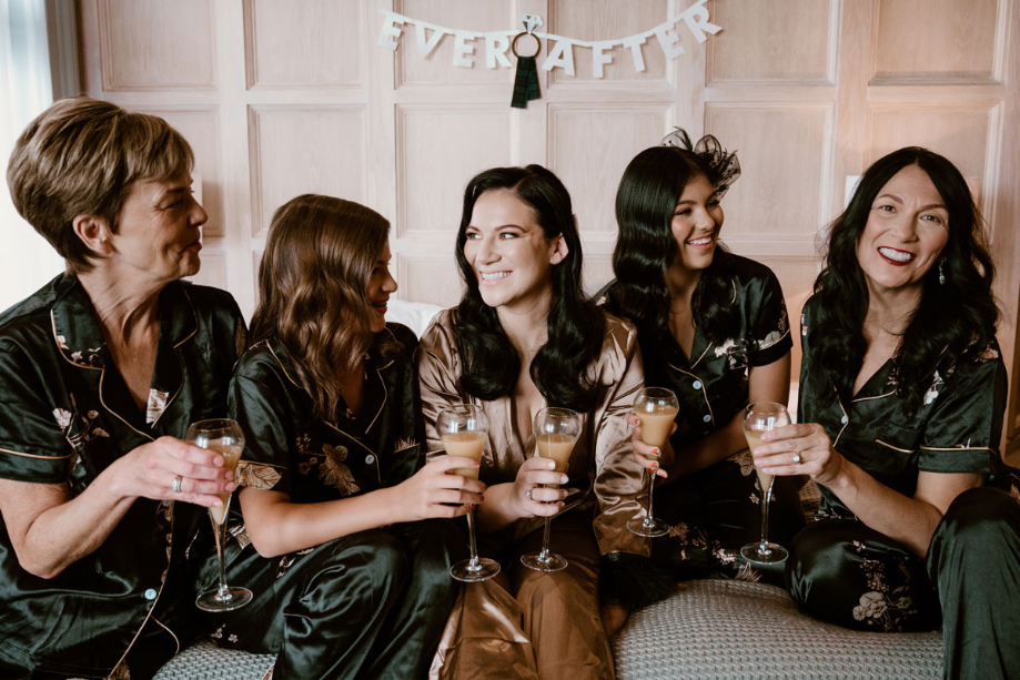 The bride and her bridesmaids in their pyjamas on the wedding morning