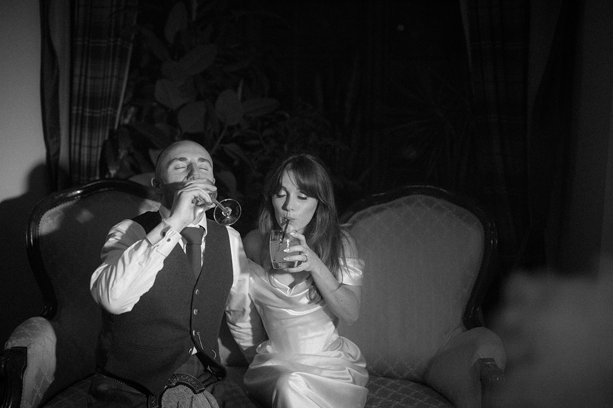 a bride and groom drinking at Achnagairn Castle