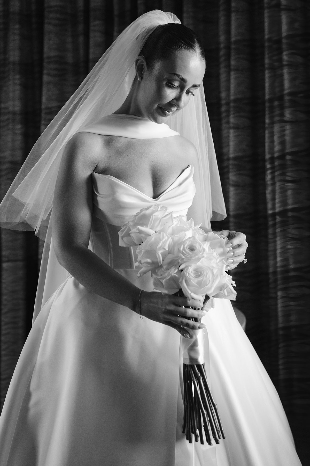 Black and white bridal portrait holding white rose bouquet at Enterkine Country House wedding in Ayrshire