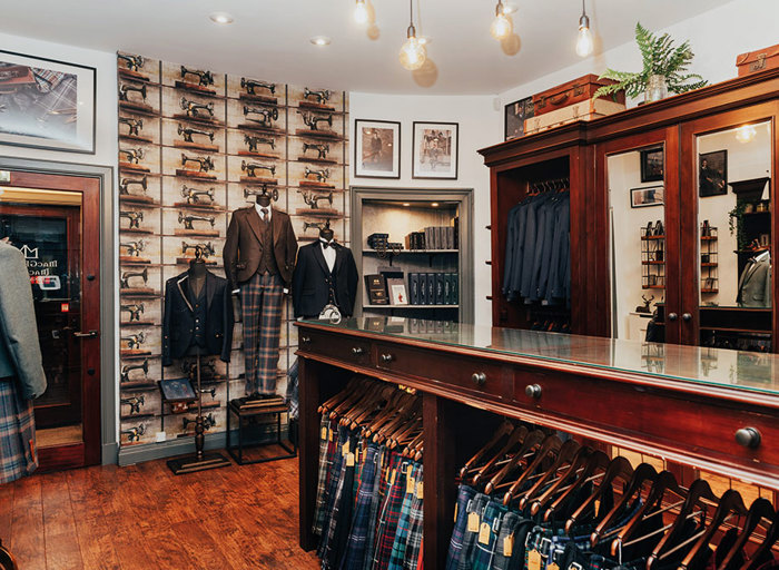 Shop floor with a selection of Highlandwear, mirrors and mannequins