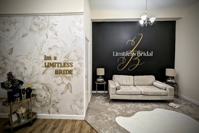 bridal dressing room with bar cart, couch and mirror