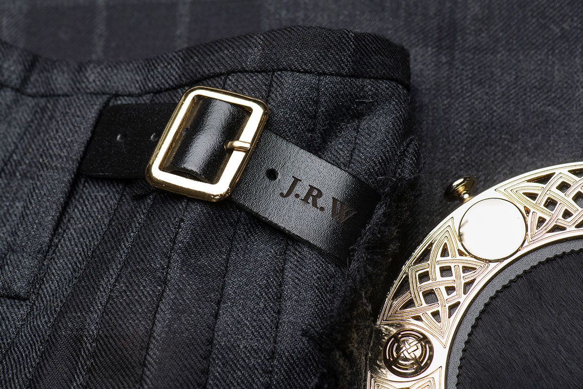 Close up of kilt details including initial personalisation