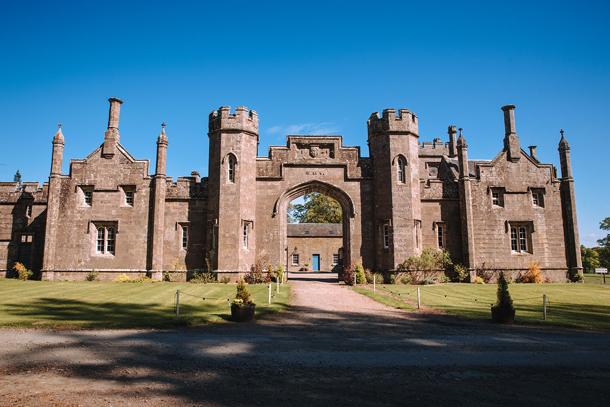 Historic stone archway entrance at Rosebery Estate wedding venue in Midlothian