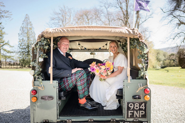 land rover jeep escorts bride and father of the bride at achnagairn castle wedding 
